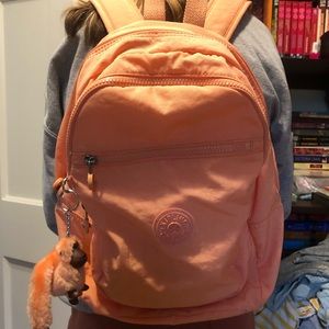 Large Kipling Backpack, light peachy orange.